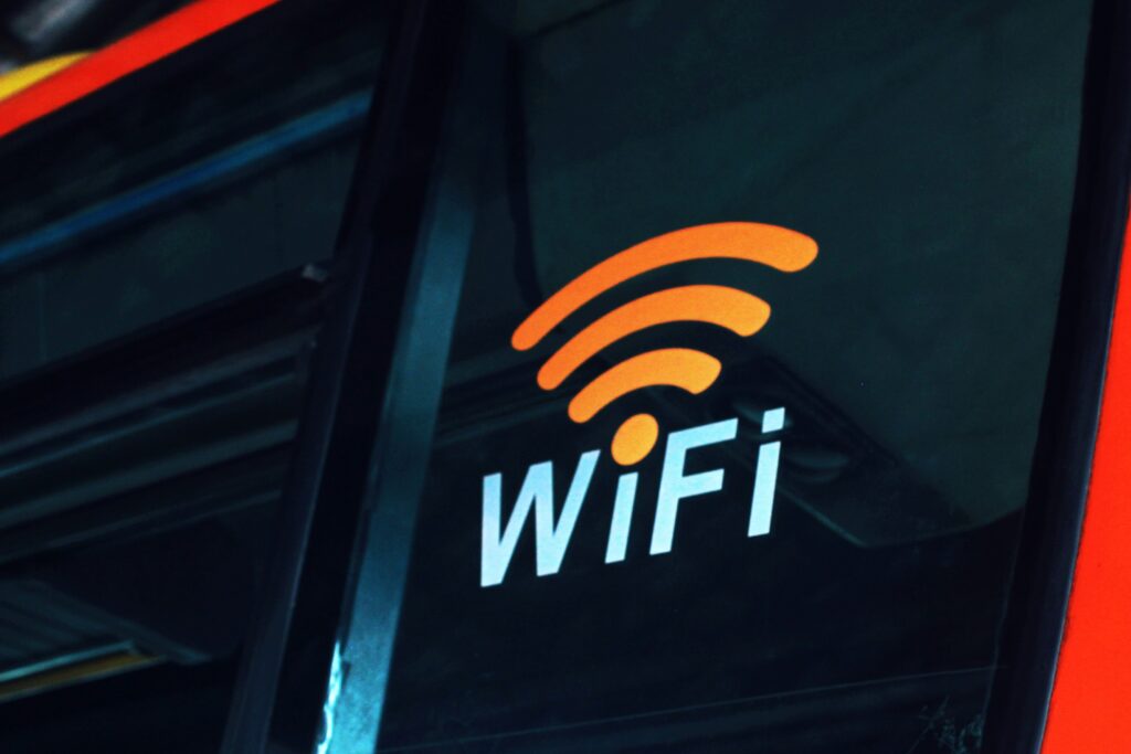 Wi-Fi symbol on glass —highlighting your home network as the first “room” to secure.