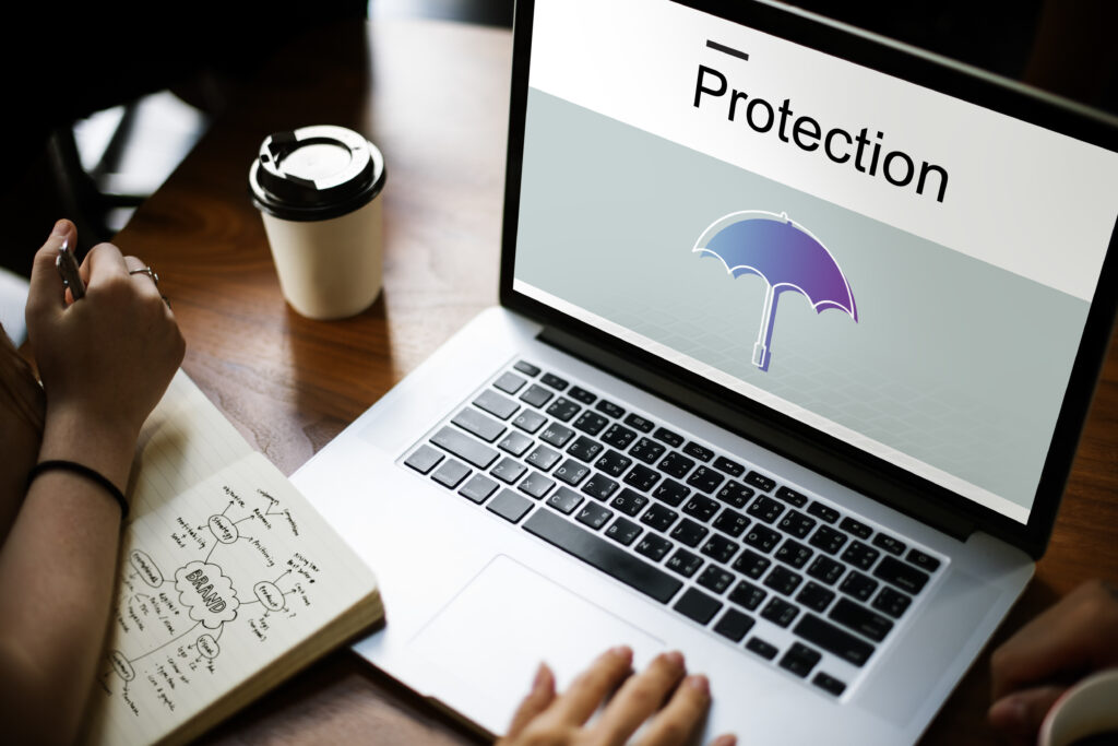 Laptop displaying “Protection” with an umbrella icon