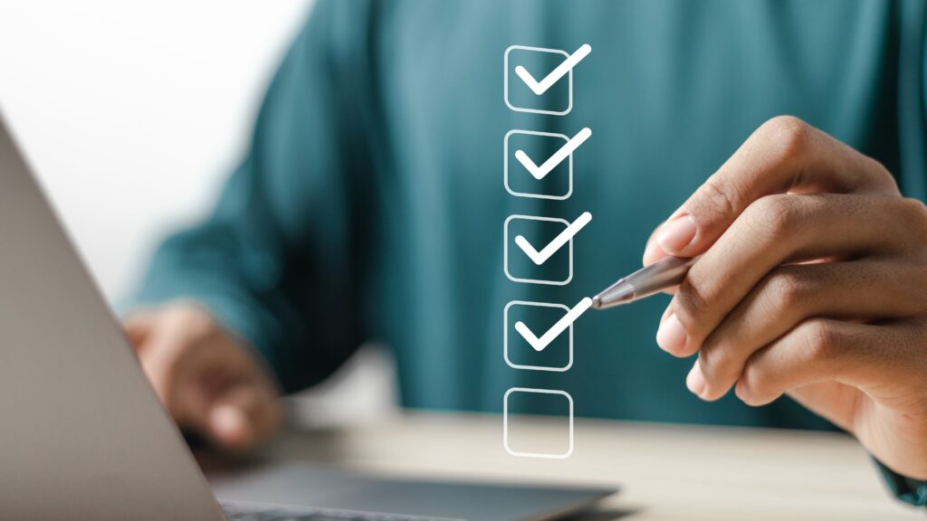 A person marking digital checkboxes on a virtual checklist, symbolizes taking clear, practical steps to strengthen online security.