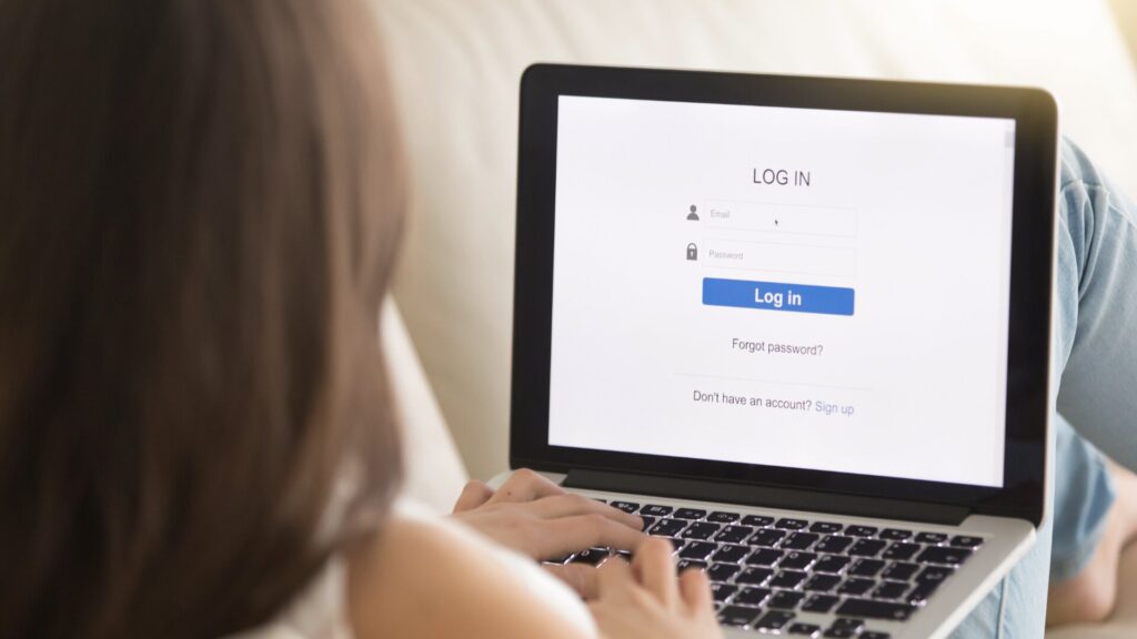 Person logging into an online account on a laptop, highlighting account security after a data leak