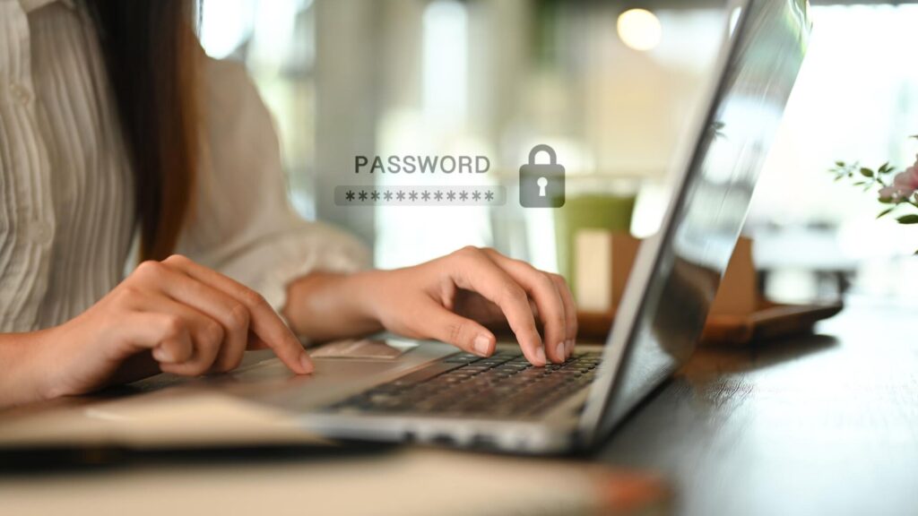 Person typing a password on a laptop while setting up stronger account security