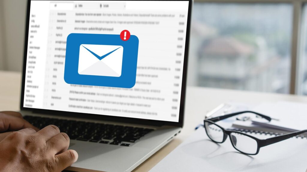 Warning email icon displayed on a laptop screen after a data breach.