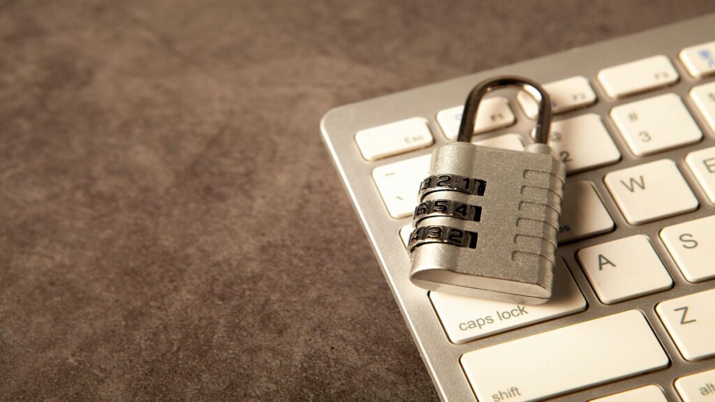 Padlock on a keyboard representing IRS IP PIN protection against tax identity theft and scam tax filings.
