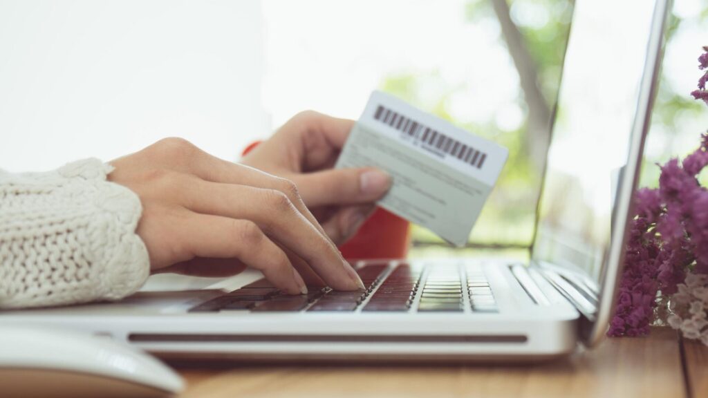 Person making an online payment after the NAIC data breach highlights the importance of protecting financial and personal information.