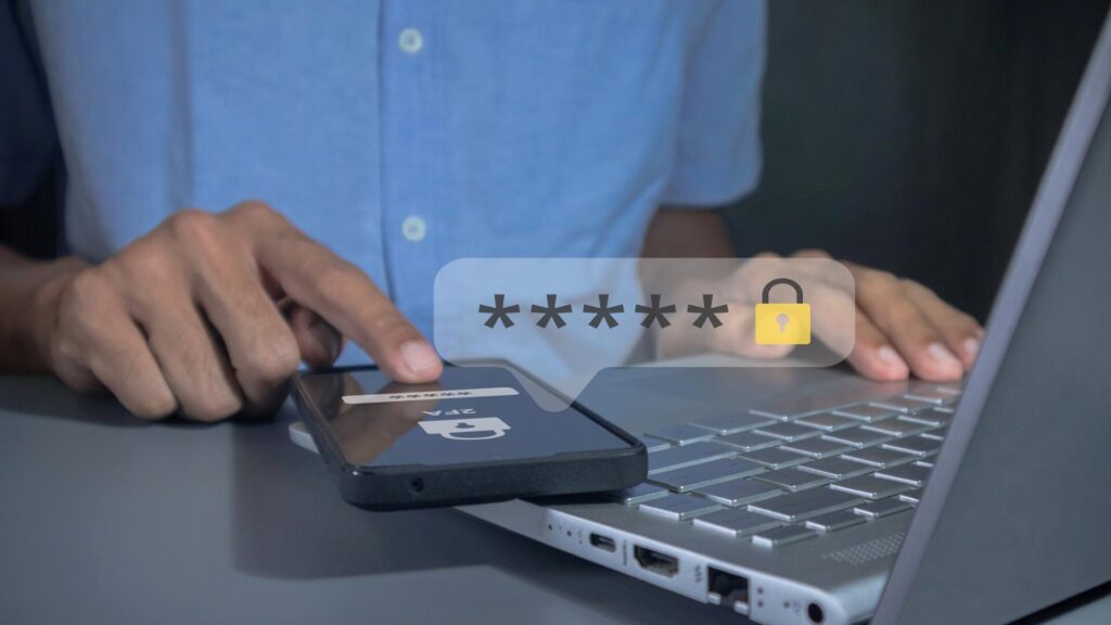 Person using two-step verification on a phone and laptop to protect an online account