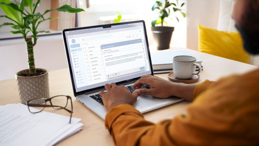 Person checking email after a university data breach