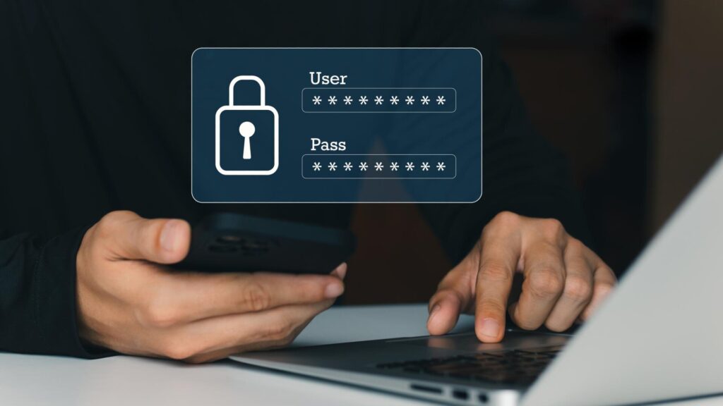 Person using a laptop and phone with a password login graphic, representing account protection after the 23andMe data breach.